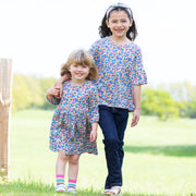 Girl in bee ditsy dress