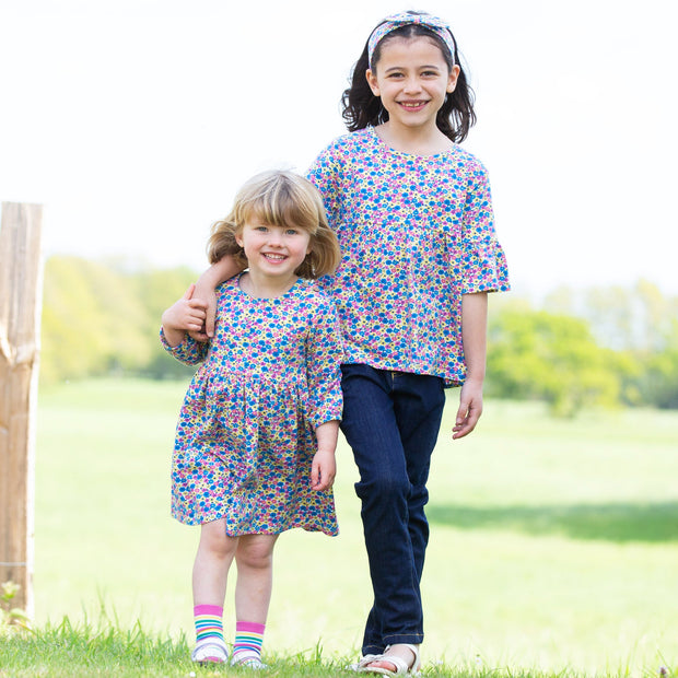 Girl in bee ditsy dress